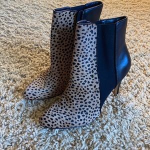 Sexy animal print type faux fur and black boots.